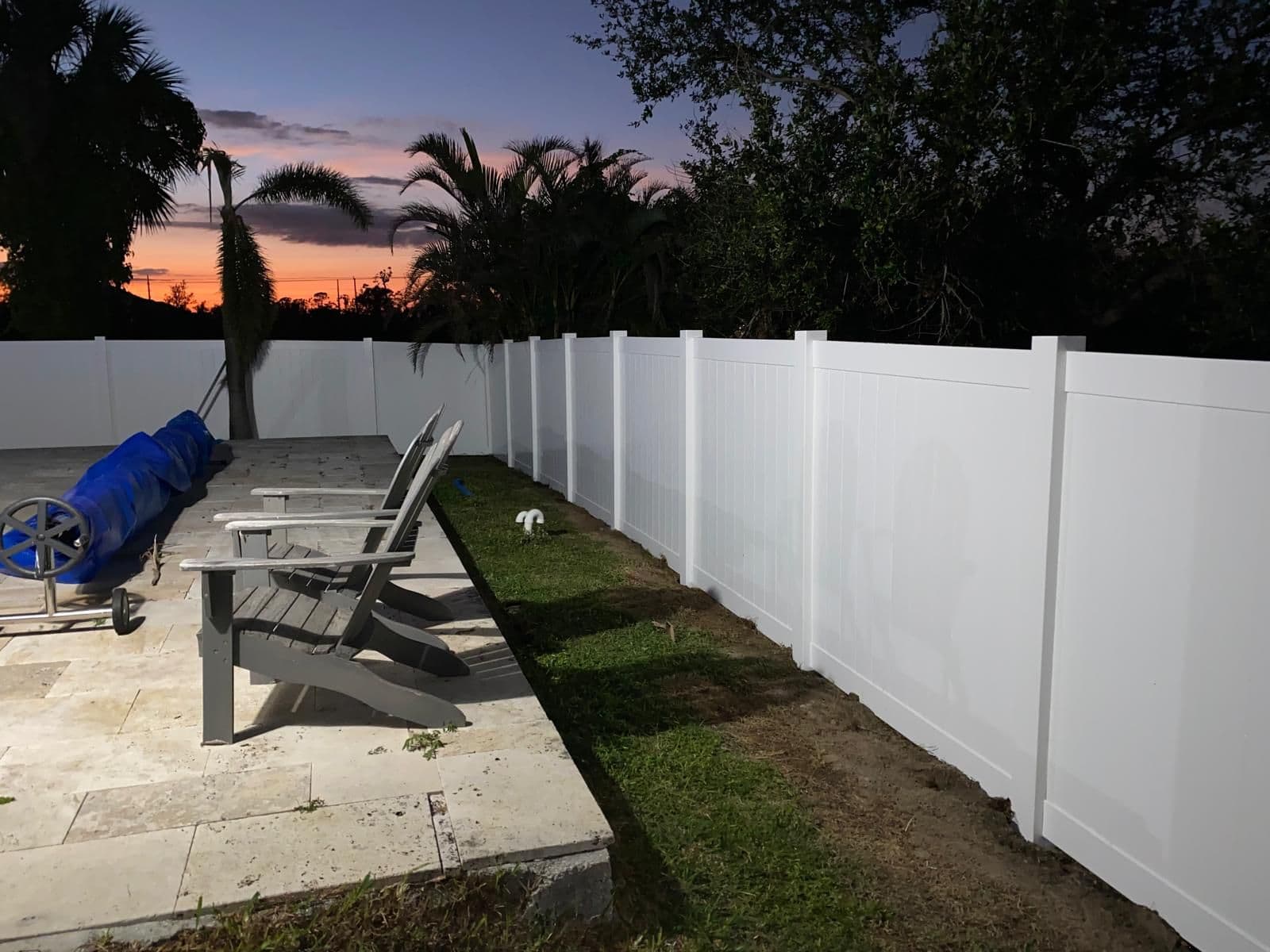 Vinyl privacy fence installed at sunset by Lobo Fences LLC